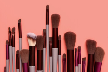 Makeup brushes on red background