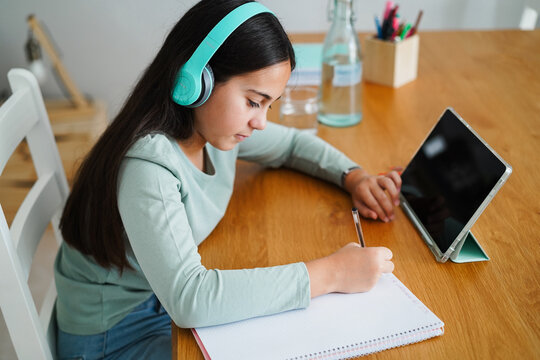Female kid doing private class before going back to school - Education and teenager lifestyle concept - Main focus on right hand - UGC content