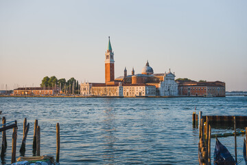 Scenic view of San Giorgio Maggiore Island across the Venetian Lagoon, featuring the historic church and iconic bell tower in Venice, Italy. © Anastasia