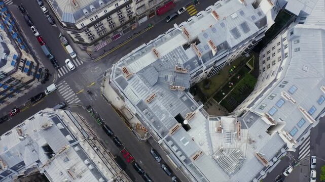 Aerial view of the dense urban architecture and intersecting streets of Paris, Ile-de-France, France.