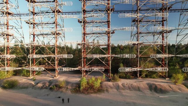 Aerial view of the massive Duga 1 Receiver radar array structure rising above the forest in Chernobyl, Kyiv Oblast, Ukraine.