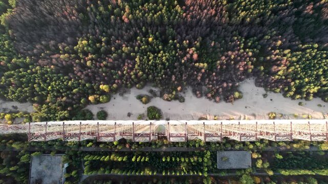 Aerial view of the Duga 1 Receiver radar array surrounded by dense forest in Chernobyl, Kyiv Oblast, Ukraine.