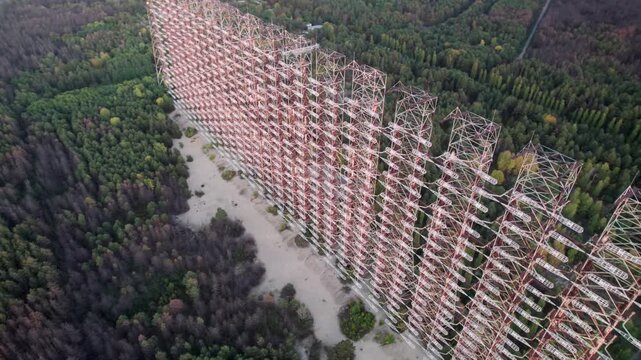 Aerial view of the massive Duga 1 Receiver radar array rising above the dense forest in the Chernobyl exclusion zone in Chernobyl, Kyiv Oblast, Ukraine.