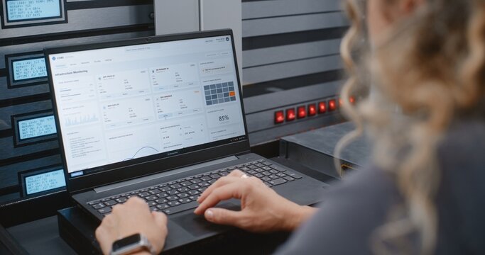 Female IT Specialist Responds to Cyber Attack Alert Using Linux Command Line, Reviewing Server Telemetry and Performing Emergency Recovery Steps During Critical Infrastructure Security Incident.