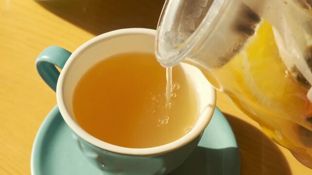 Making hot lemon tea with honey, autumn winter comfort drink, seasonal wellness, warming beverage for cold weather, cozy seasonal moment