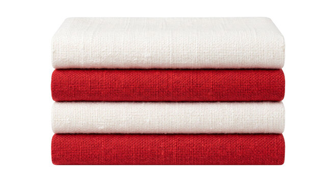 Stack of folded red and white linen fabric textiles for home decor
