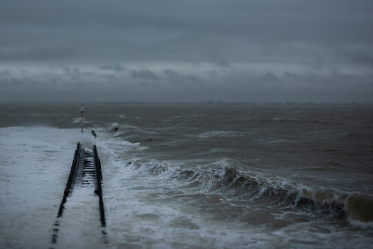 Stormy sea with rough waves at pier in Vlissingen the Netherlands