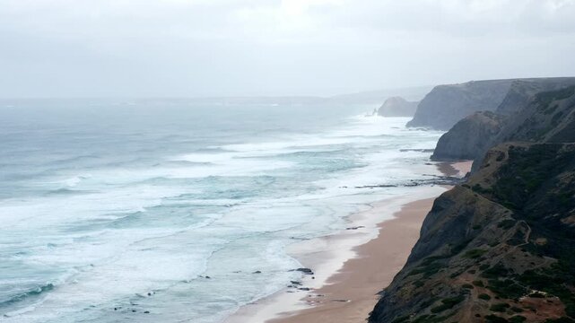 Coastal view from Castelejo Viewpoint over Praia do Castelejo in Vila do Bispo, Algarve, Portugal, with Atlantic Ocean, cliffs, and surf