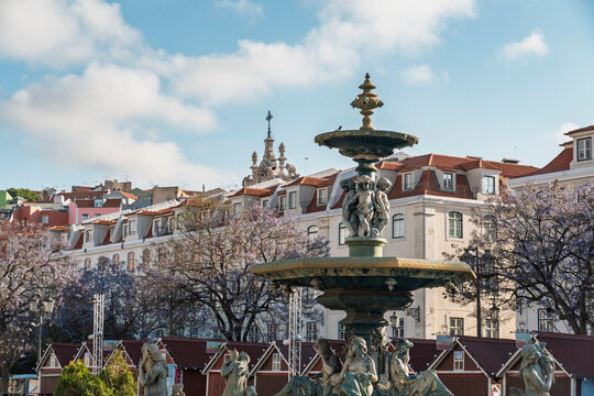 The bronze fountain stands in historic Rossio Square in Lisbon