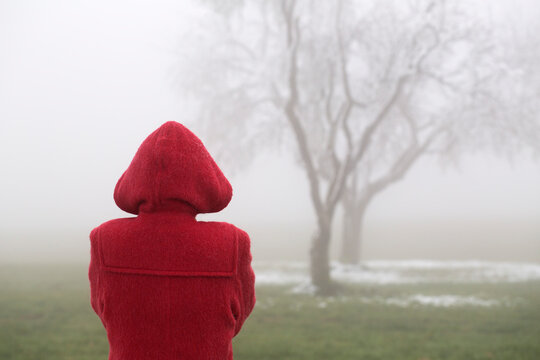 Austria, one teenager standing alone in park