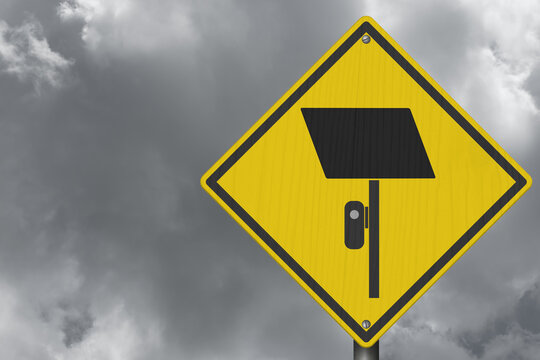 Surveillance camera icon yellow warning sign with stormy sky for license plate reader LPR
