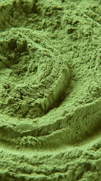 Chlorella or spirulina algae green powder is spinning. Dietary supplement to improve health. Seaweed superfood. Healthy food background. Vitamins to diet. Detox. Close up vertical format video