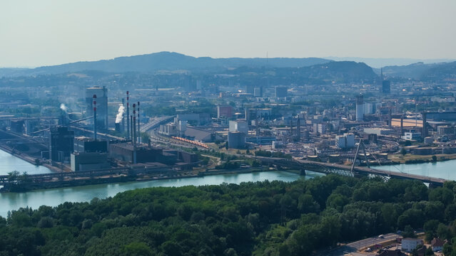 Aerial view of the large steel manufacturing and metallurgical industrial complex located along the Danube river in Linz, Upper Austria, Austria.