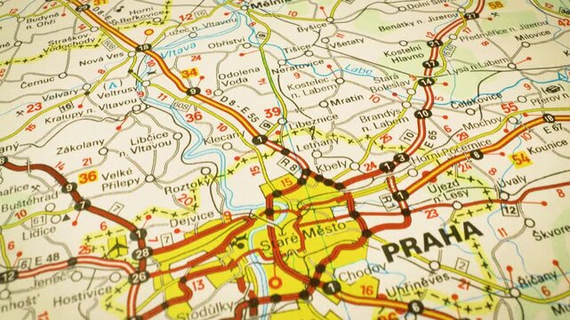 road network leading to prague czech republic gliding over atlas map