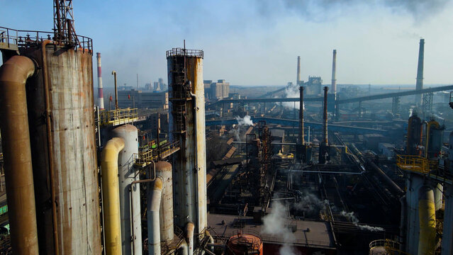 Factory, industrial enterprise, metallurgical plant, smoke from chimneys, aerial photography from a drone.