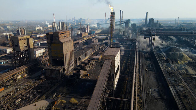Factory, industrial enterprise, metallurgical plant, smoke from chimneys, aerial photography from a drone.