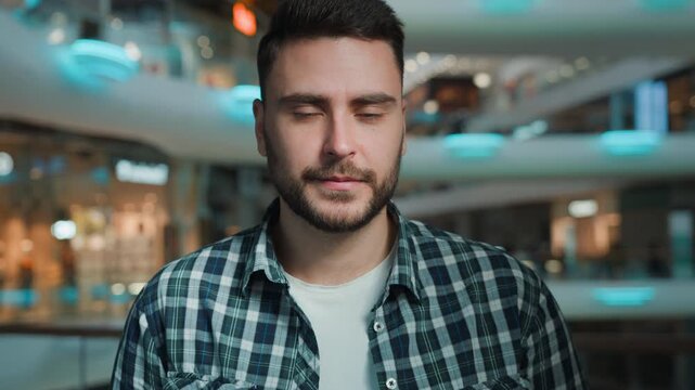 Close-up portrait confused Caucasian man looking at camera shrug shoulders unsure answer with doubt business male doubtful businessman European student guy client hesitate in shopping mall company