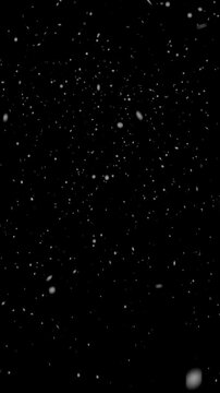 Vertical Realistic Falling Snowflakes Background Overlay. Seamless Winter Snowfall Loop. Snow Particle Effect for 9:16 Video and Motion Graphics.