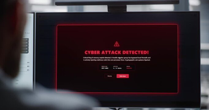 Professional IT Specialist Monitoring Dual Displays as Cyber Attack is Resolved, Emphasizing System Recovery, Secure Operations, Digital Resilience, and Protection of Critical Infrastructure.