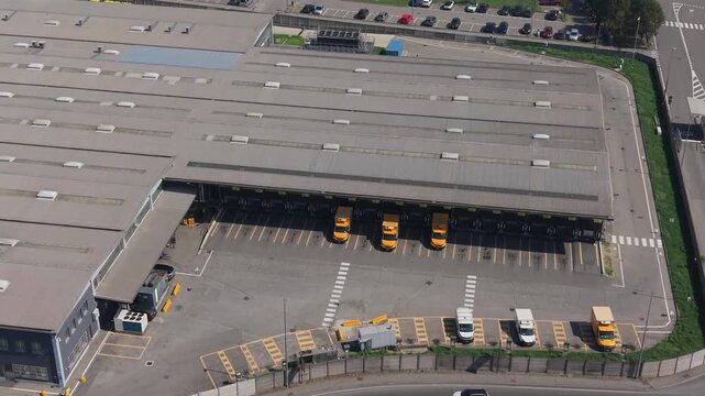 Sesto Ulteriano, Lombardia, Italy - 05 September 2026: Aerial view of the Esselunga Spa logistics facility with loading bays and parked trucks.