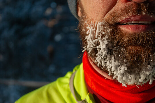 Ice crystals and frozen breath covering runner beard in subzero winter weather