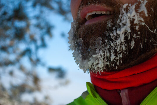 Frozen beard covered with frost and ice after a long winter run