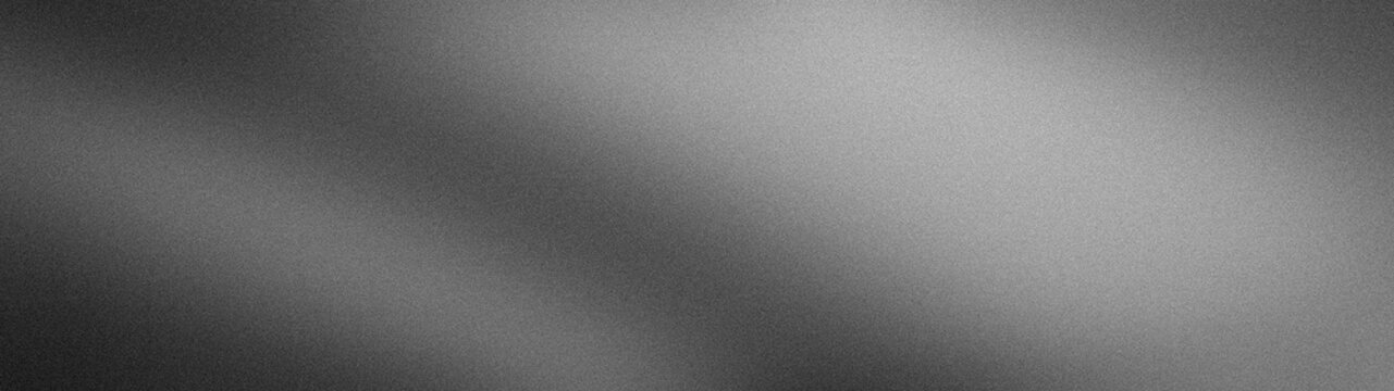 Black gray and white grainy textured abstract background with blur and gradient in wide format for tech wallpaper design