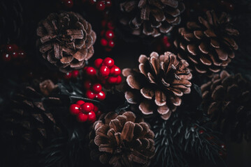 Christmas postcard background wreath pine cone tree. Merry Christmas and Happy new year greeting card. Coniferous berry texture decoration with white snow. 2027 New year eve poster wallpaper banner. © hitdelight