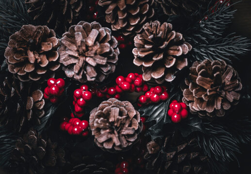 Christmas greeting card background with xmas wreath pine cone tree. Merry Christmas and Happy new year postcard. Coniferous berry texture decoration with white snow. 2027 New year eve celebration