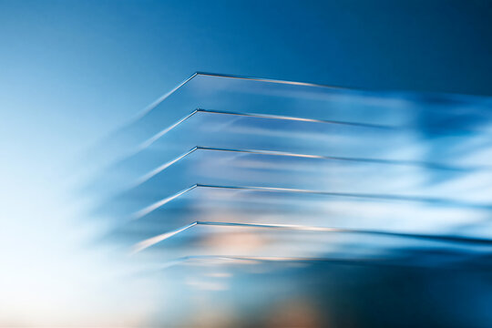 Abstract Layered Glass Edges with Blue Light and Shallow Depth of Field Background