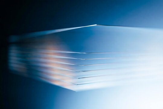 Abstract Layered Glass Edges with Blue Light and Shallow Depth of Field Background