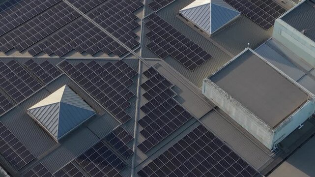 Melbourne, VIC, Australia - 03 September 2026: Aerial view of Knox Data Centre featuring extensive solar panel arrays and geometric skylights on the industrial roof.
