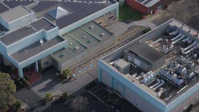 Melbourne, VIC, Australia - 03 September 2026: Aerial view of Knox Data Centre featuring industrial rooftops, solar panels, and cooling units.