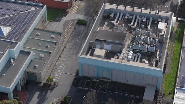 Melbourne, VIC, Australia - 03 September 2026: Aerial view of Knox Data Centre with rooftop cooling infrastructure and adjacent solar panels.