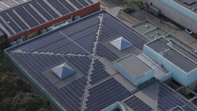 Melbourne, VIC, Australia - 03 September 2026: Aerial view of the Knox Data Centre roof covered in extensive solar panel arrays, featuring pyramid-shaped skylights and industrial architecture.