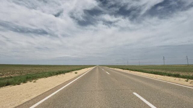 Driving forward on a straight asphalt road