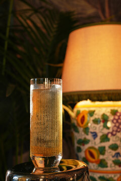 Sparkling Highball Cocktail with Clear Ice Block and Mint Leaf Garnish