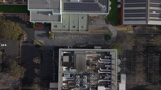 Melbourne, Australia - 03 September 2026: Aerial view of Knox Data Centre showing industrial rooftop infrastructure, cooling units, and surrounding parking lots.