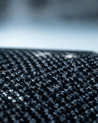 Fototapeta premium Macro close-up of carbon fiber weave with glossy resin coating texture