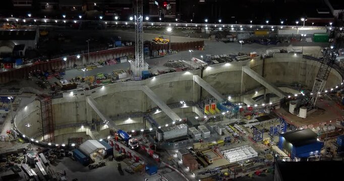 London, England - 21 March 2026: Aerial view of the HS2 Victoria Road Crossover Box construction site at night, featuring deep excavation, heavy machinery, and bright floodlights.