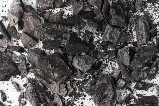 background black charcoal texture. Close-Up of Charred Wood Texture After Burning