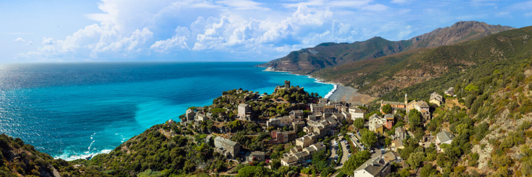 Nonza perched cliff village Corsica high resolution drone panorama with black pebble beach Genoese tower turquoise sea  Cap Corse landscape. wall art print Wide 3:1 aspect ratio travel photography