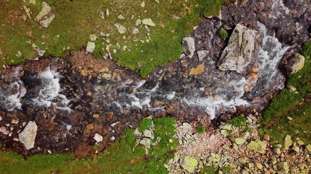 Aerial View of Mountain Stream Flowing Over Rocks