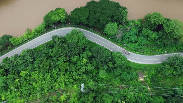 Eco-friendly transport. Aerial view road and green forest, green environment Rainforest landscape with trees and fog - theme conservation,	