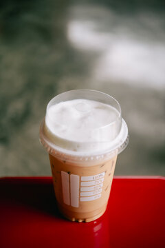 Coffee in a plastic cup to take home Black coffee.