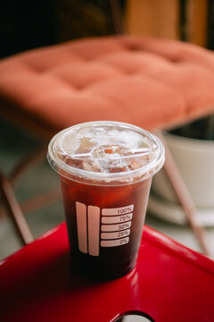 Coffee in a plastic cup to take home Black coffee.