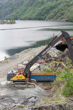 August 16, 2026, Saudasj&oslash;en, Norway - Volvo EC530E long reach excavator on a construction site by a fjord