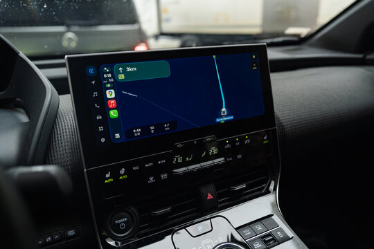 August 16, 2026, S&aelig;b&oslash;, Norway - Car interior showing infotainment system with navigation map and climate controls