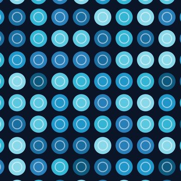 A vibrant grid of multicolored circular dots arranged on a solid black background. Each colorful circle features a subtle inner ring, creating a repetitive geometric pattern.