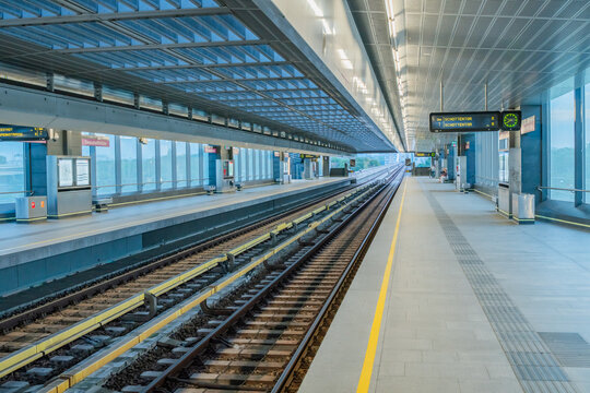 View of Donaustadtbrucke subway station featuring modern architecture, glass walls, and railway tracks, Wien, Wien, Austria.